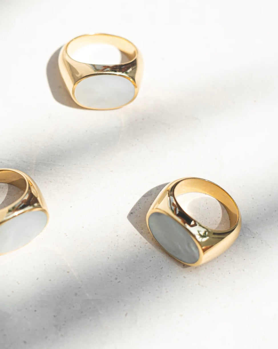 Mother of pearl , golden signet ring