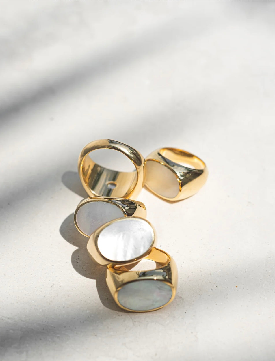 Mother of pearl , golden signet ring
